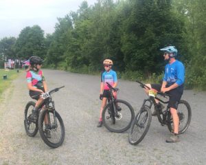 Coach and athletes discuss things before the race.
